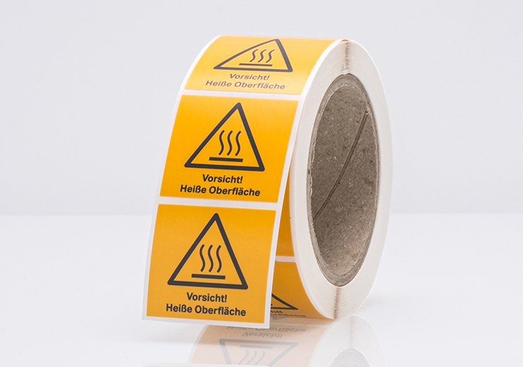 Hitzebeständige Etiketten auf der Rolle für heiße Oberflächen mit Warndreieck.